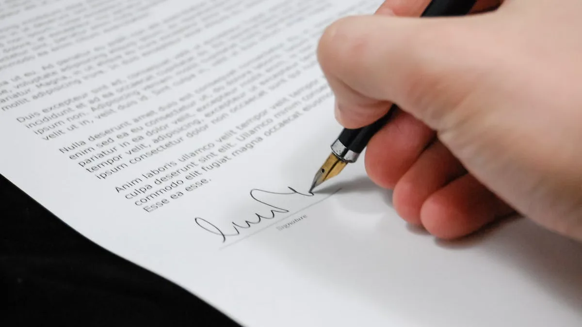 Person signing a financial document with a pen