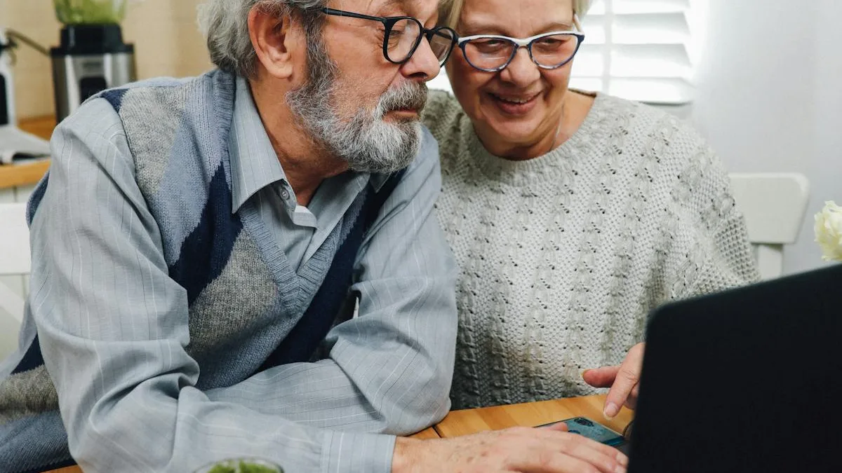 Happy senior couple using a laptop at home